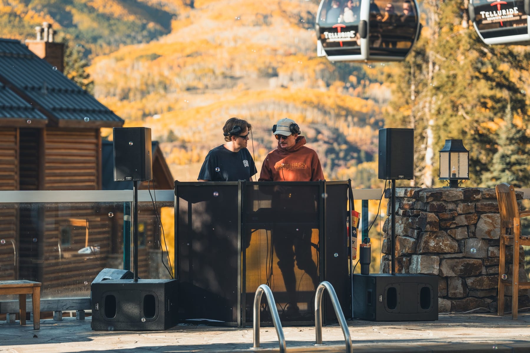 Hank and a guest DJ at the pool-deck booth, gondola overhead